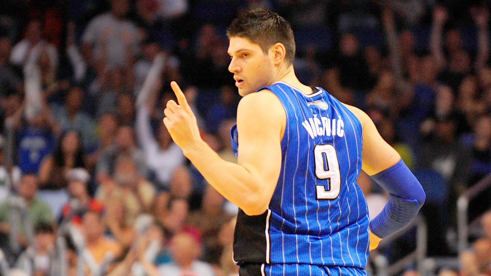 Mar 28, 2014; Orlando, FL, USA; Orlando Magic center Nikola Vucevic (9) celebrates after scoring against the Charlotte Bobcats at Amway Center. Center.The Magic won 110-105 in overtime. Mandatory Credit: David Manning-USA TODAY Sports